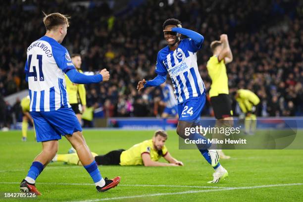 Simon Adingra of Brighton & Hove Albion celebrates with teammate Jack Hinshelwood after scoring their team's first goal during the Premier League...