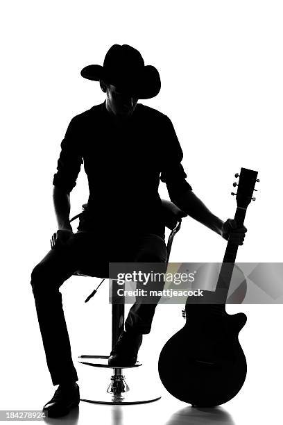 country and western silhouette - acoustic guitar white background stock pictures, royalty-free photos & images