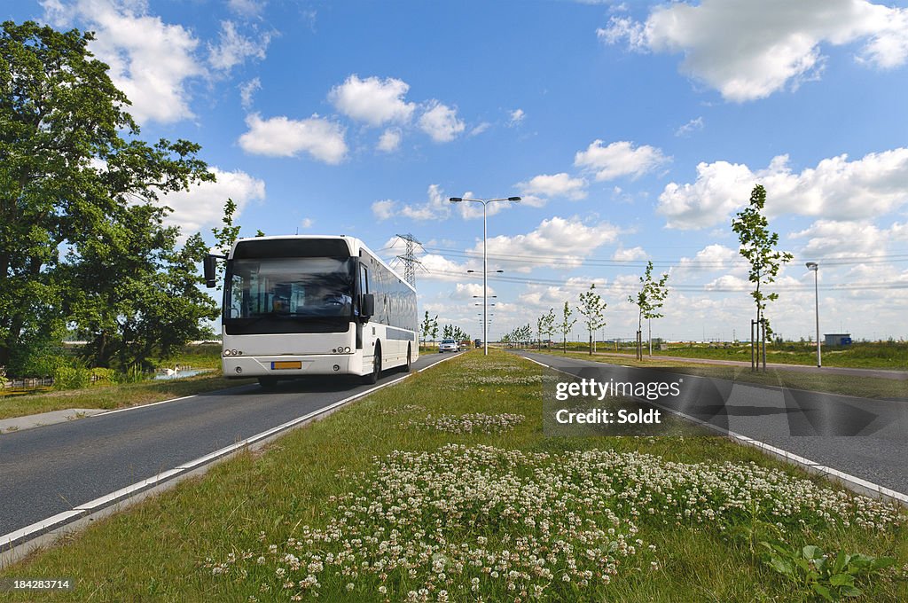 Approaching bus in dutch landscape