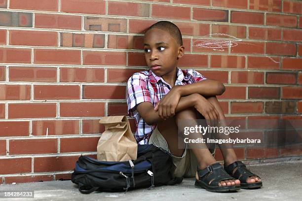 sad school boy who has been bullied. - abandoned school stock pictures, royalty-free photos & images