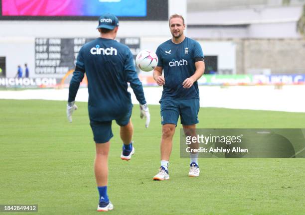 Liam Livingstone and Ollie Pope of England play football as rain delays the start of play during the third CG United One Day International match...