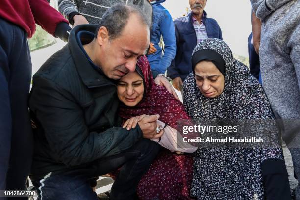 The uncle, mother Sana'a and aunt Sahar of Muhammad Abdullah Hasaballah, a 22-year-old man killed by air strikes in Khan Yunis, react as they attend...