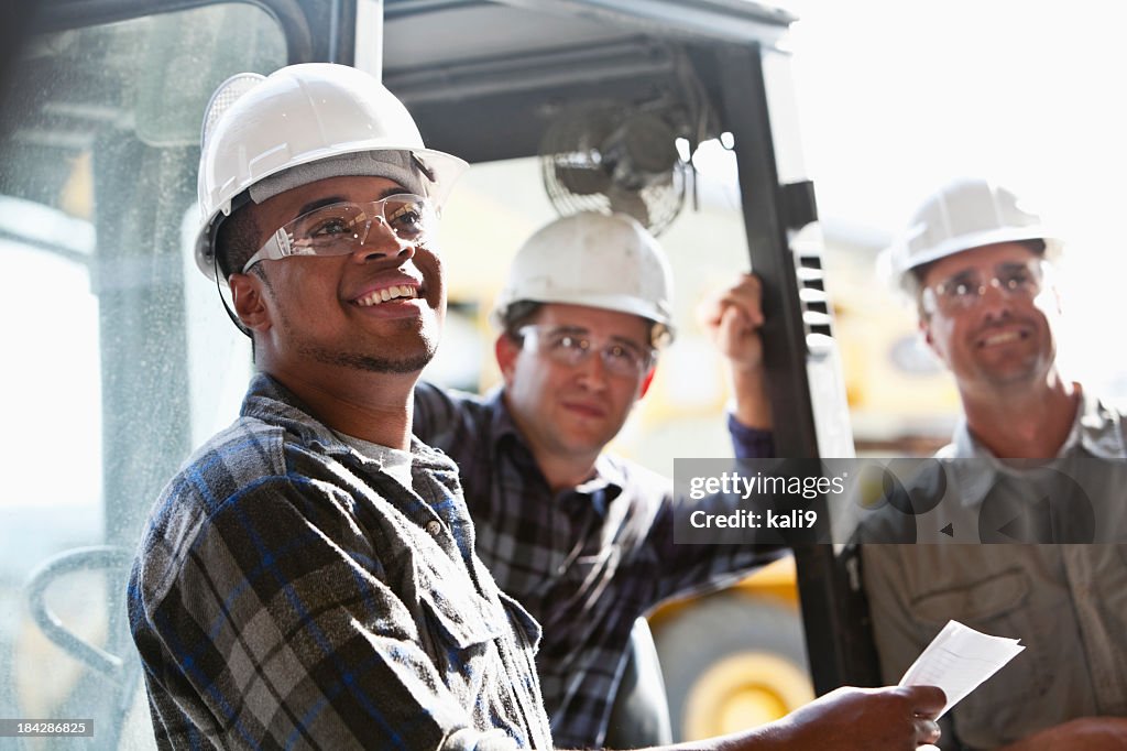 Industrial workers with forklift