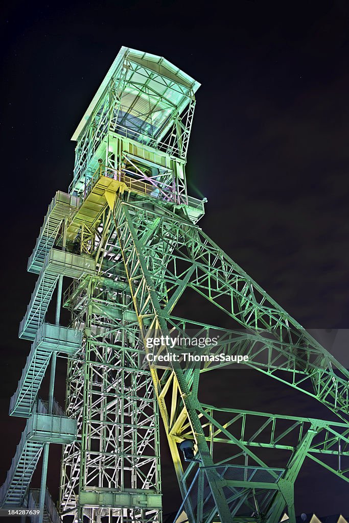 Old illuminated mine head frame