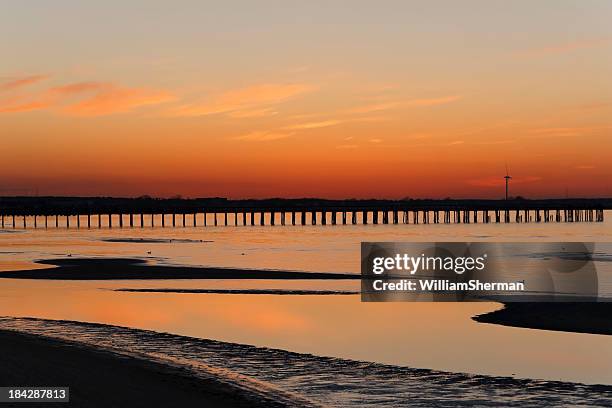 vivid cape henlopen delaware sunset - delaware bay stock pictures, royalty-free photos & images