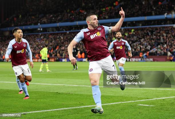 John McGinn of Aston Villa celebrates scoring their team's first goal during the Premier League match between Aston Villa and Arsenal FC at Villa...