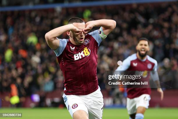 John McGinn of Aston Villa celebrates scoring their team's first goal during the Premier League match between Aston Villa and Arsenal FC at Villa...