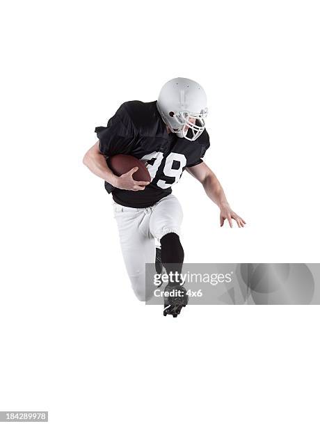 football player in action - american football player isolated stock pictures, royalty-free photos & images