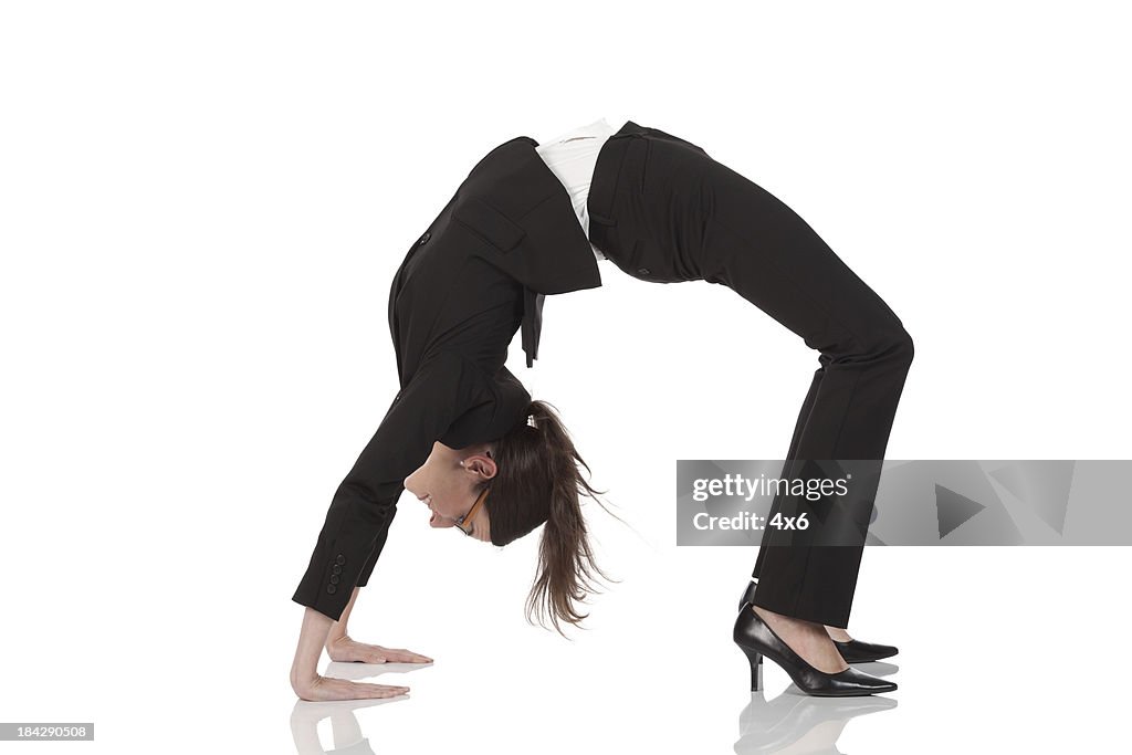 Businesswoman practicing yoga