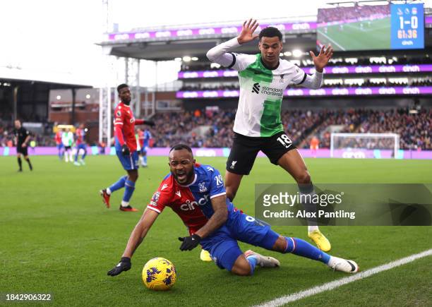 Jordan Ayew of Crystal Palace is tackled by Cody Gakpo of Liverpool during the Premier League match between Crystal Palace and Liverpool FC at...