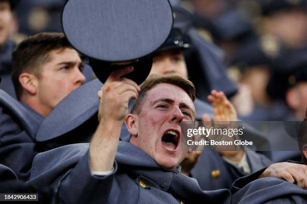 Foxborough, MA Army cadets cheer after Army Black Knights running back Tyson Riley scores a touchdown against Navy in the first half. Army beat Navy,...