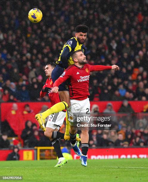 Bournemouth striker Philip Billing heads in the second goal despite the challenge of Manchester United defender Luke Shaw during the Premier League...