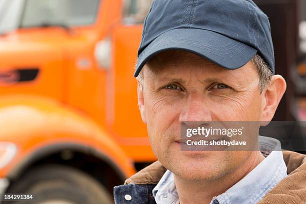 serious trucker - orange hat stock pictures, royalty-free photos & images
