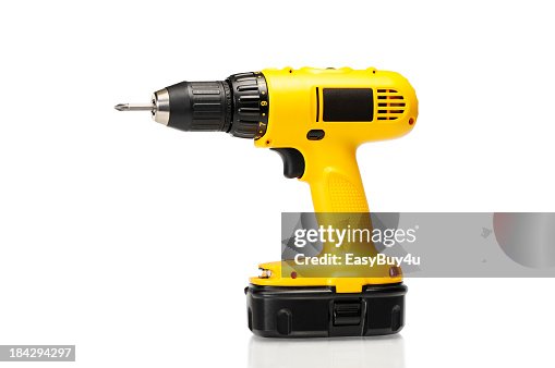 Cordless yellow power drill isolated on a white background