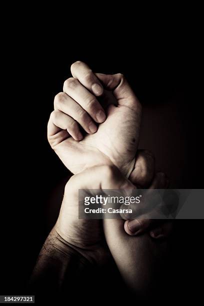 holding tight - violence stock pictures, royalty-free photos & images