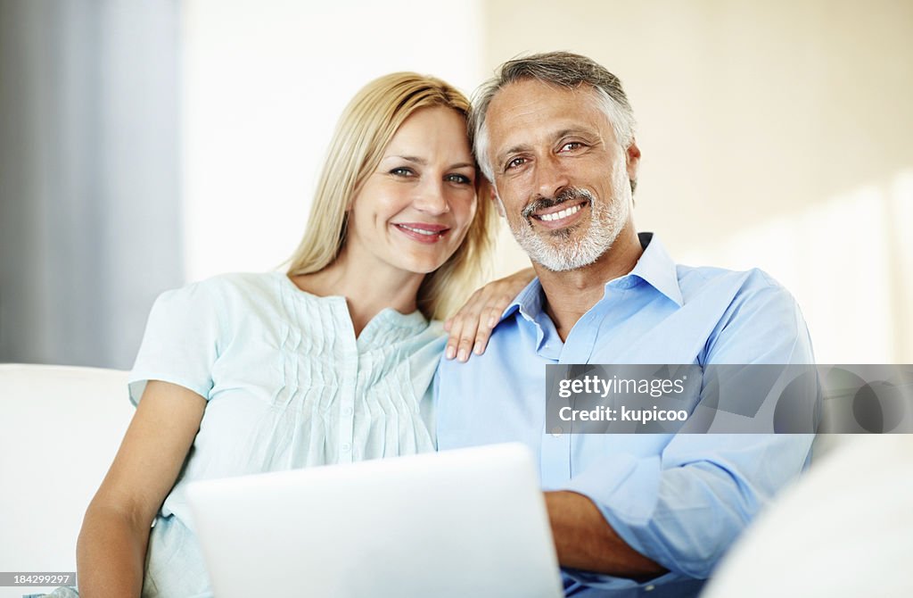 Good looking couple with laptop