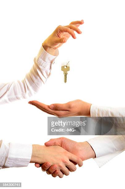two men closing deal and handing over keys - handing over keys bildbanksfoton och bilder