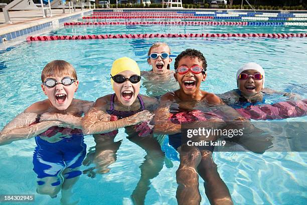 multi-ethnic group of children shouting in swimming pool - boys club stock pictures, royalty-free photos & images