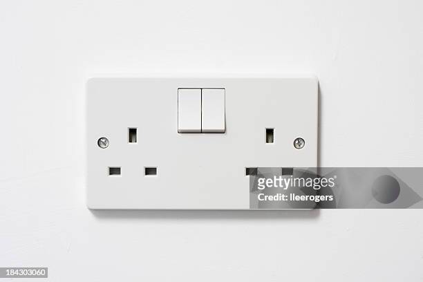 uk british electrical plug socket and plug on a wall - outlet stock pictures, royalty-free photos & images