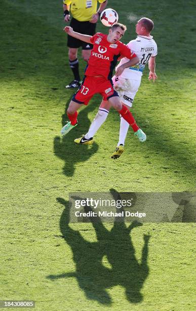 Steve Lustica of United and Jamie Maclaren of the Glory contest for the ball during the round one A-League match between Perth Glory and Adelaide...