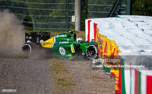 Giedo van der Garde of Netherlands and Caterham crashes after the start of the Japanese Formula One Grand Prix at Suzuka Circuit on October 13, 2013...