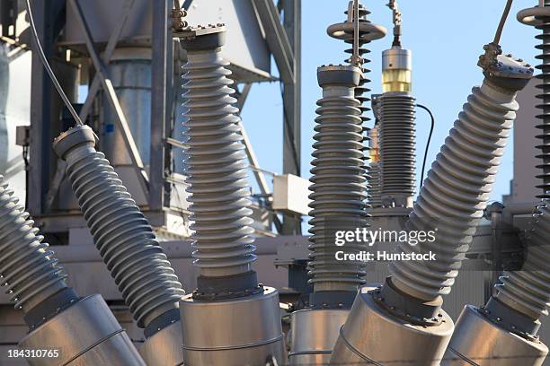 high voltage transformers at electric plant - hochspannungstransformator stock-fotos und bilder