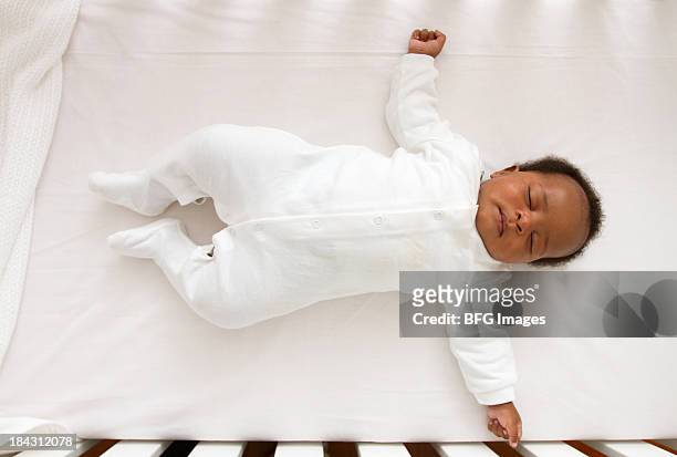 african baby sleeping in crib, cape town, south africa - baby bassinet bildbanksfoton och bilder
