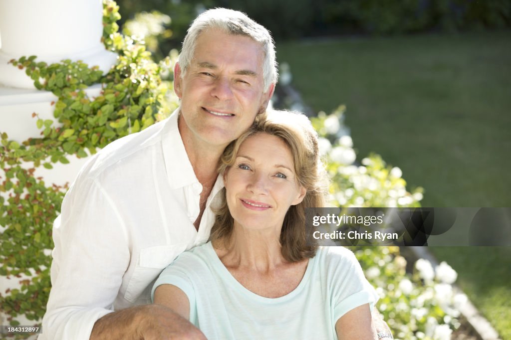 Portrait of smiling senior couple in garden