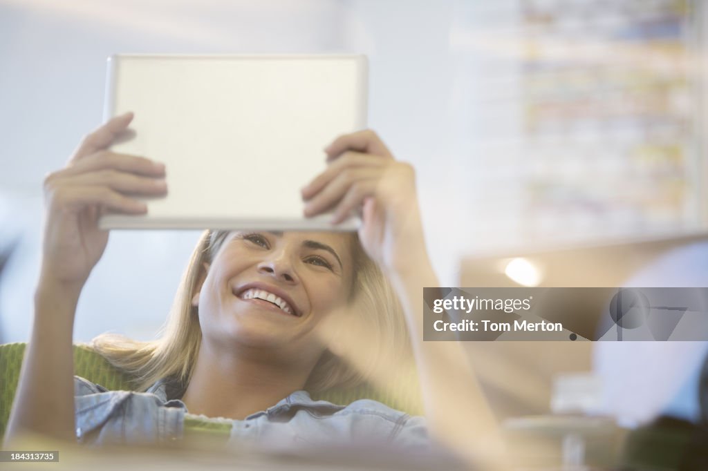 Businesswoman using digital tablet in office