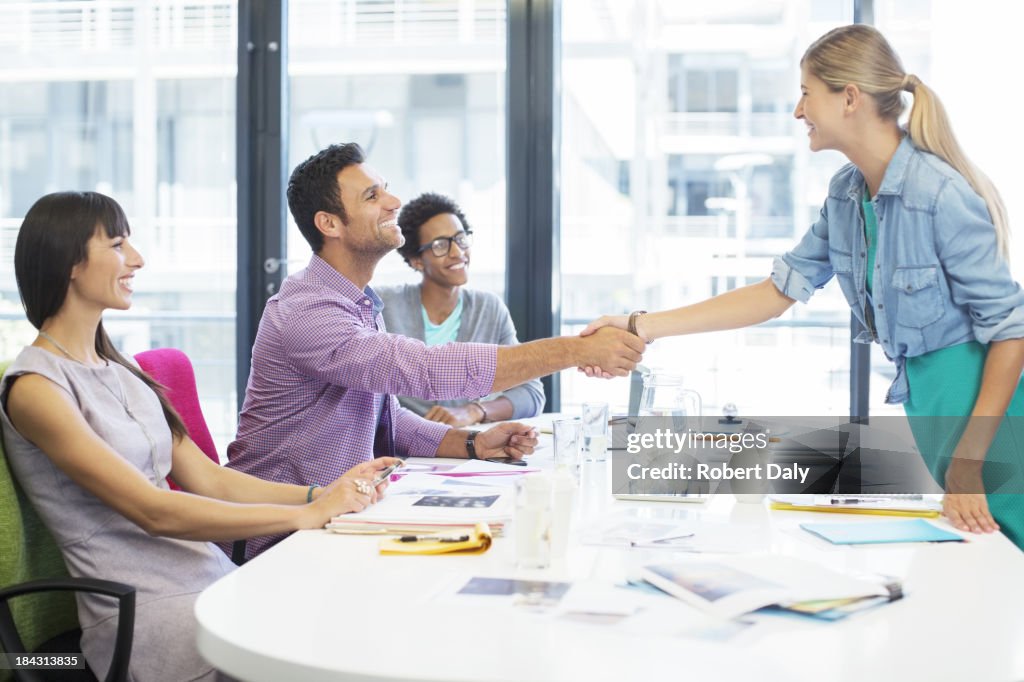 Business people shaking hands in meeting