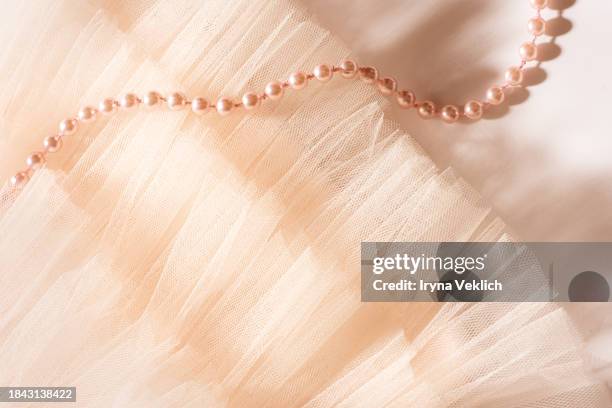 texture of gorgeous flowy tutu tuile nylon skirt in natural pastel pink beige peach color. - peach colour stock pictures, royalty-free photos & images
