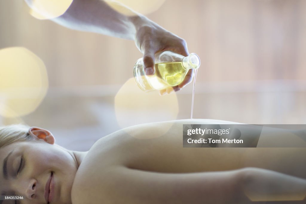 Woman receiving massage at spa