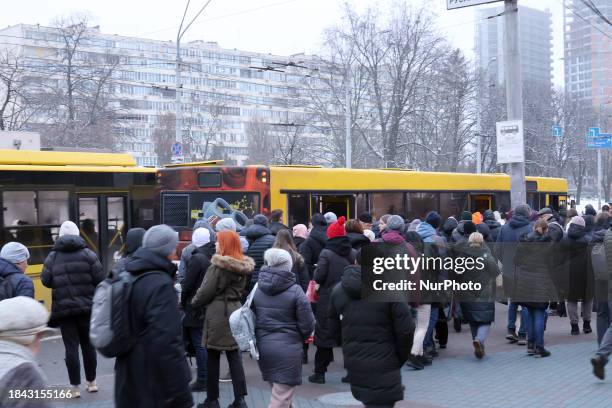 Passengers are boarding a bus at the Lybidska metro station in Kyiv, Ukraine, on December 12 as additional buses and trolleybuses are in operation...