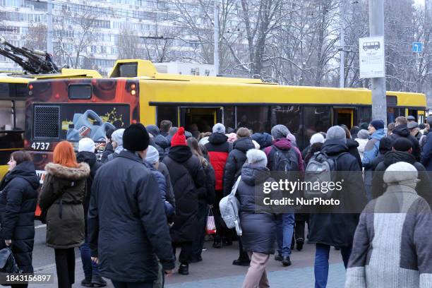 Passengers are boarding a bus at the Lybidska metro station in Kyiv, Ukraine, on December 12 as additional buses and trolleybuses are in operation...