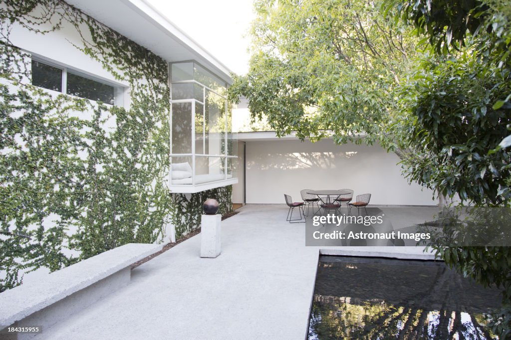 Table and chairs in modern courtyard