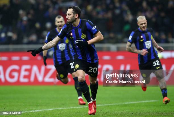 Hakan Calhanoglu of FC Internazionale celebrates scoring their team's first goal during the Serie A TIM match between FC Internazionale and Udinese...