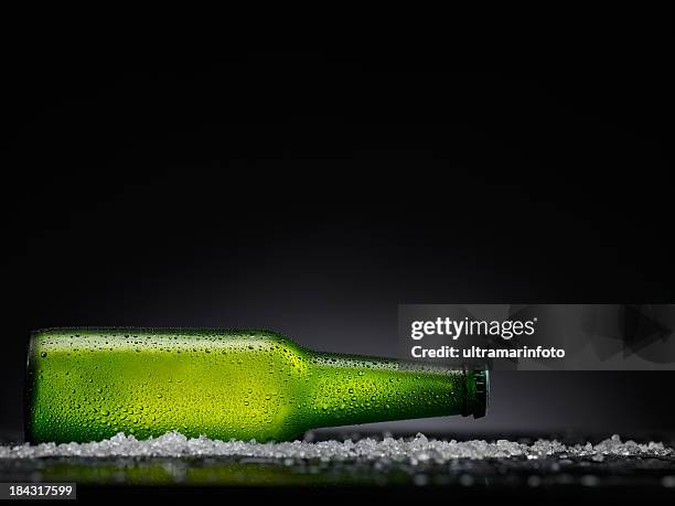 ice cold  beer bottle - bottle condensation stock pictures, royalty-free photos & images