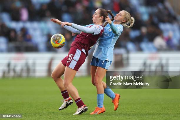 Lucy Parker of Aston Villa battles for possession with Laura Coombs of Manchester City during the Barclays Women´s Super League match between...