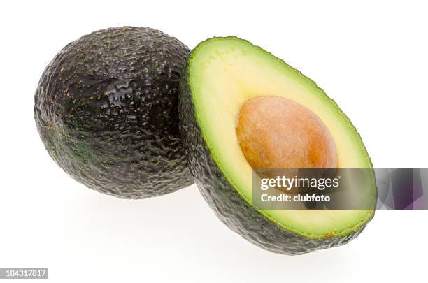 avocado on a white background - avocado stockfoto's en -beelden