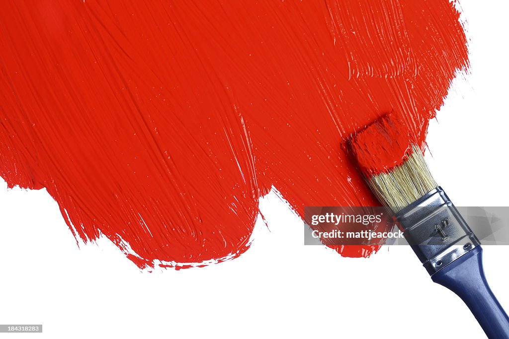 Red paint on a paintbrush