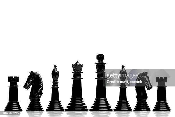 black chess pieces - chess pieces stock pictures, royalty-free photos & images