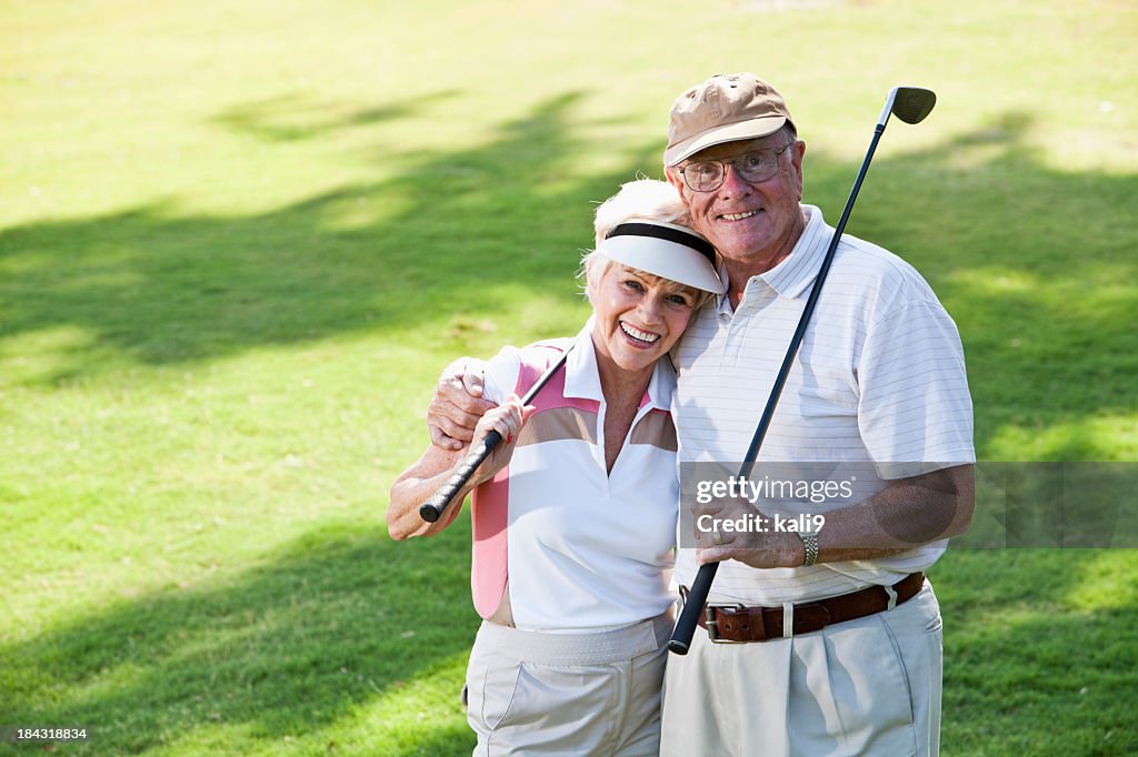 Senior couple playing golf