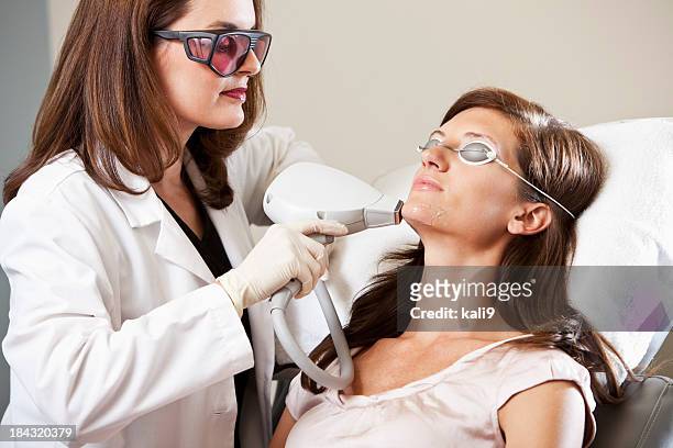 laser hair removal - esthetician stock pictures, royalty-free photos & images
