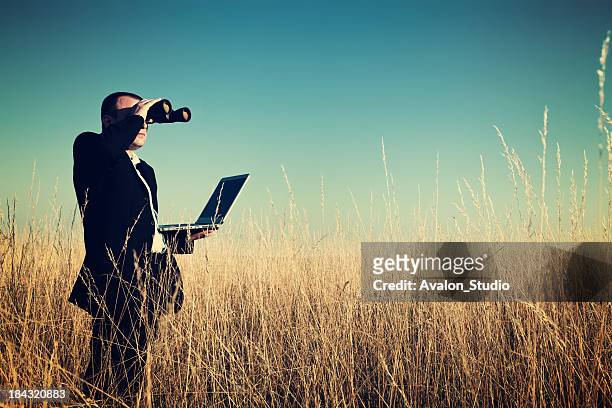 businessman looking field for investment. - watching stock pictures, royalty-free photos & images