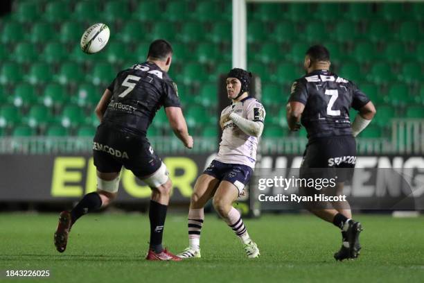 Will Reed of Dragons RFC kicks the ball past Ewan Johnson and Manu Leiataua of Oyannax Rugby during the EPCR Challenge Cup match between Dragons RFC...