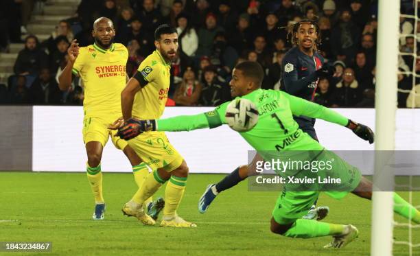 Bradley Barcola of Paris Saint-Germain scores his first goal over Alban Lafont of Nantes during the Ligue 1 Uber Eats match between Paris...
