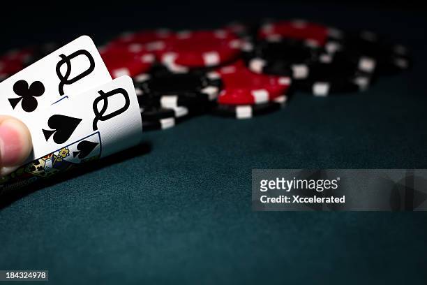pocket queens with red & black poker chips - blackjacks stock pictures, royalty-free photos & images