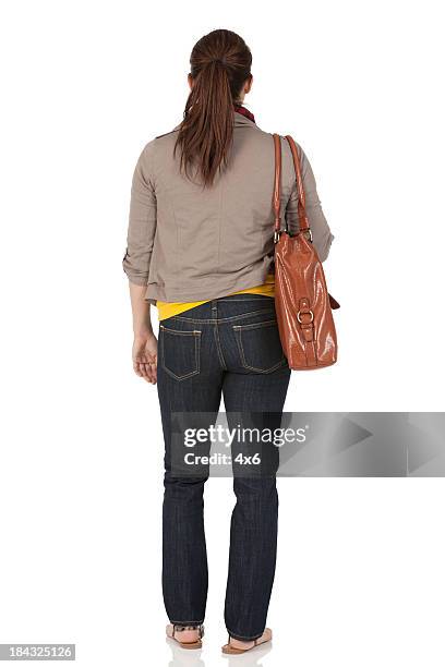 frau stehend mit tasche - woman full body behind stock-fotos und bilder