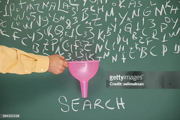 searching and filtering words on blackboard via funnel - vinden stockfoto's en -beelden