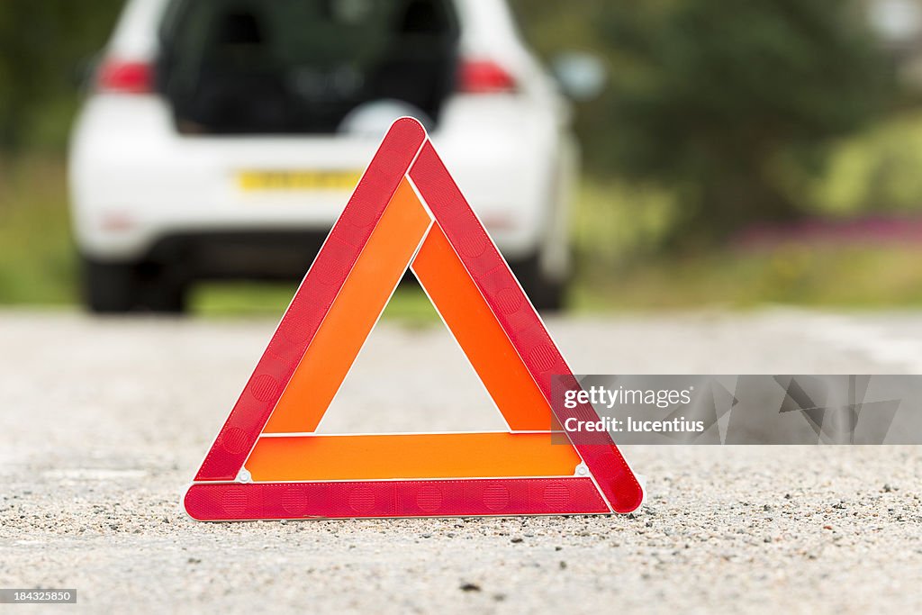 Warning triangle on road used for automobile breakdown